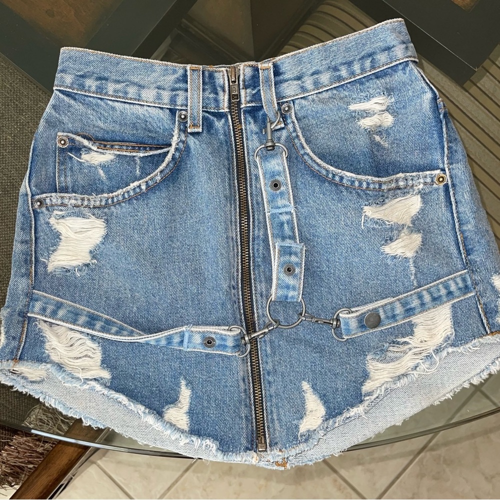 Distressed denim mini skirt